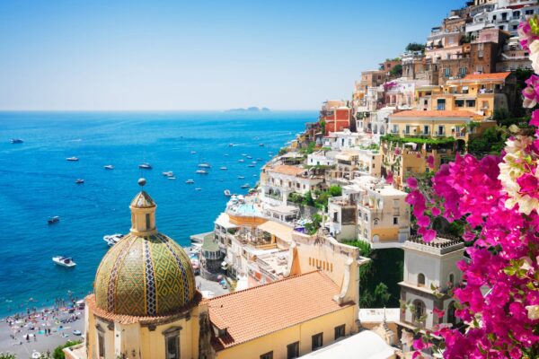 view of Positano with flowers - famous old italian resort, Italy